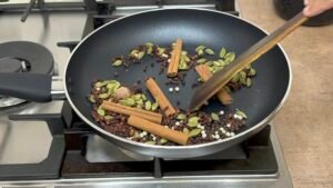 Dry roast ingredients in frying pan